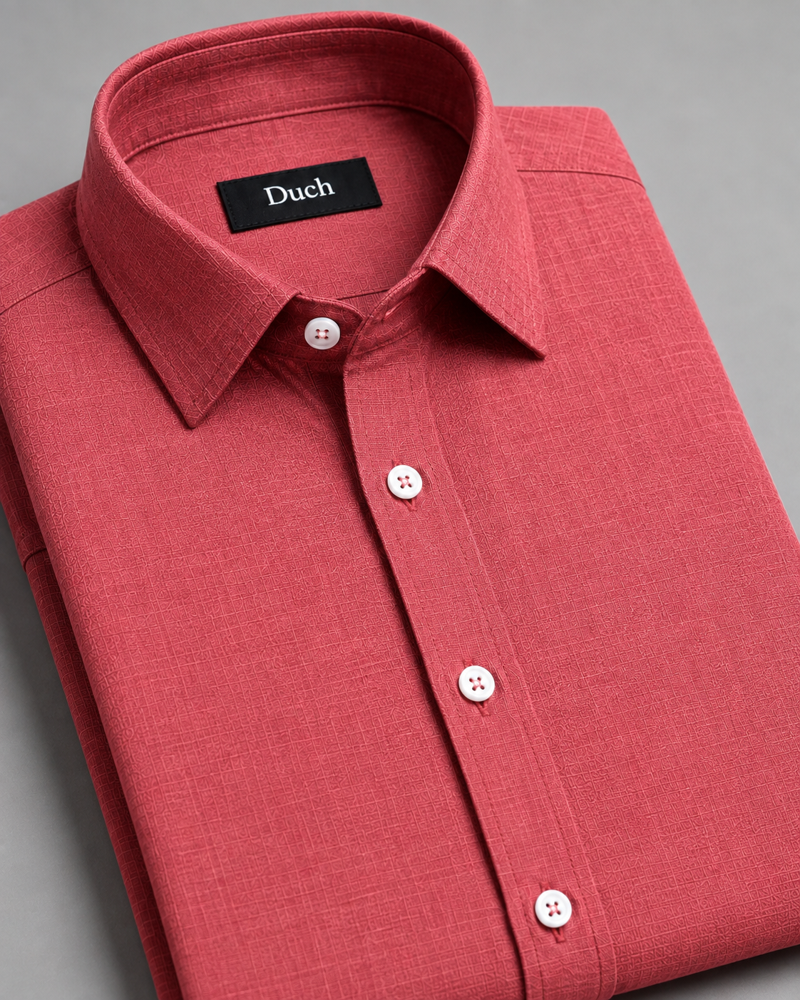 Dusty rose linen shirt folded – collar and button detail | Duch Clothing